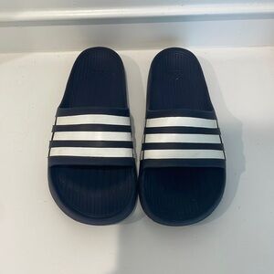 Navy blue men’s adidas slides